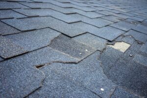 Damaged or missing shingles on an asphalt shingle roof