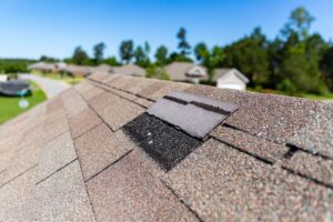 Damaged Shingle from a storm or wind damage on the roof